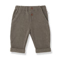 Pair of brown children's pants with buttons on a white background
