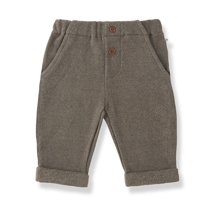 Pair of brown children's pants with buttons on a white background