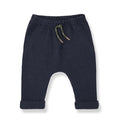 Navy blue baby pants with a drawstring on a white background