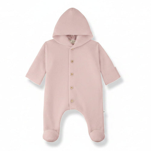 blush pink baby onesie with a hood on a white background