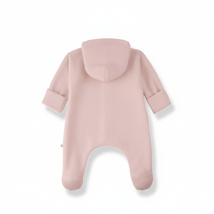 A pale blush pink baby footed one-piece with a hood, shown from the back on a white background.