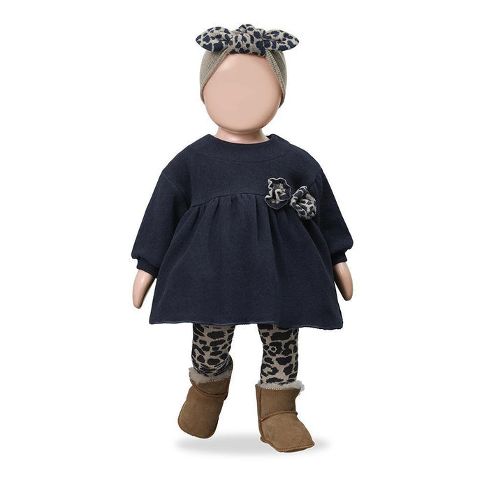 A doll or mannequin wearing a navy blue dress with leopard-print accents, a matching headband, patterned leggings, and brown boots, shown against a plain white background.
