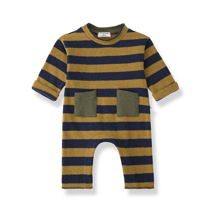 A baby knit jumpsuit with horizontal navy blue and mustard yellow stripes, featuring two olive green front patch pockets and a leg opening cutout, shown on a white background.