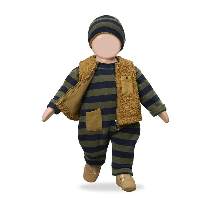A doll or mannequin dressed in a striped navy and olive green one-piece outfit with a tan sherpa vest, matching beanie, and tan shoes, shown against a plain white background.