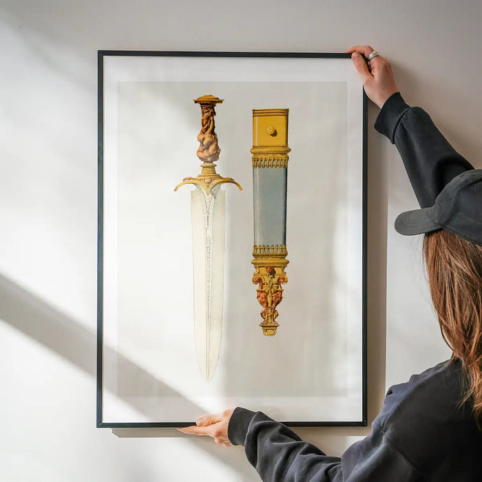 Ancient Dagger Illustration 3 print being hung on a wall in a black frame