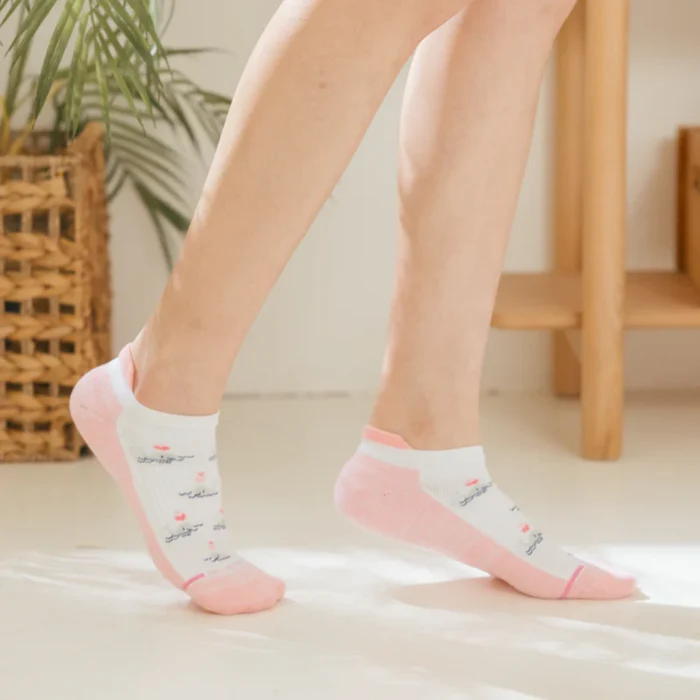 Woman wearing Dr. Motion whale ankle compression socks during daily walking for comfort and circulation support