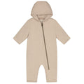 A baby hooded romper in a light oatmeal beige color, featuring a front zipper and short sleeves, shown against a plain white background.