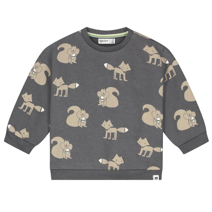 A dark gray long-sleeve crewneck sweatshirt with an all-over print of cartoon squirrels and foxes in beige and white, shown flat against a white background.