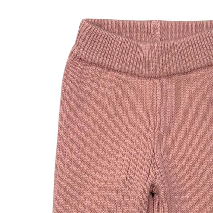 A pair of ribbed knit baby pants in a dusty rose pink color, featuring an elastic waistband and elastic cuffs, shown against a plain white background.