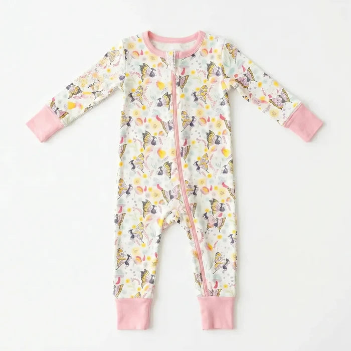 A baby long-sleeve footless zip-up sleeper with a butterfly and floral print, featuring pink cuffs and a pink zipper, laid flat on a white background.