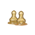Two gold-colored baby bottle nipples on a white background