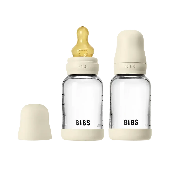 BIBS baby bottles with beige caps on a white background