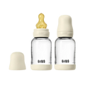 BIBS baby bottles with beige caps on a white background