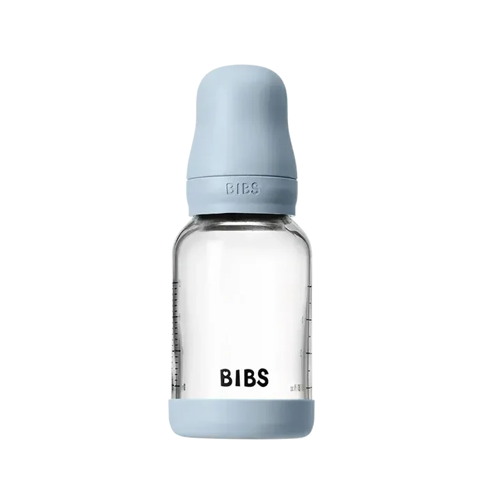 Clear baby bottle with light blue cap and 'BIBS' branding on a white background