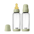 Two clear baby bottles with green caps and nipples on a white background, featuring the brand 'Bibs'.