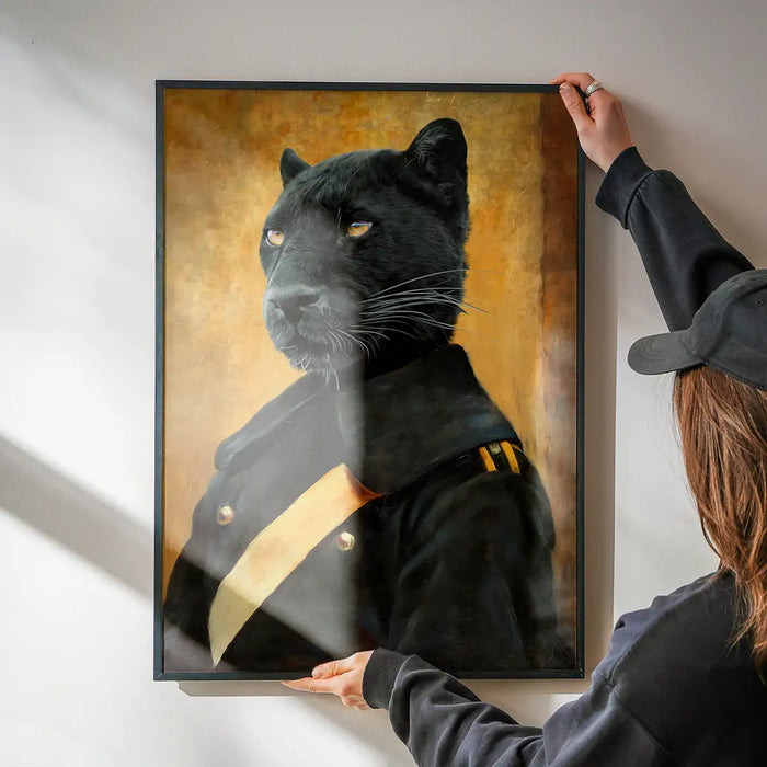 Black Panther Portrait Print being hung on a wall in a black frame
