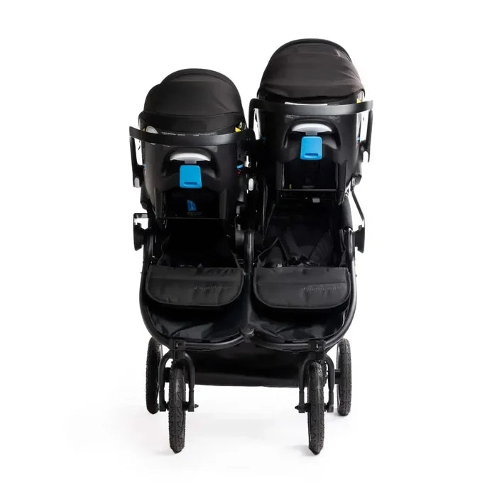 Black double stroller with two car seats on a white background