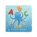 Children's book titled 'A B C by The Sea' with an octopus illustration on a blue background.