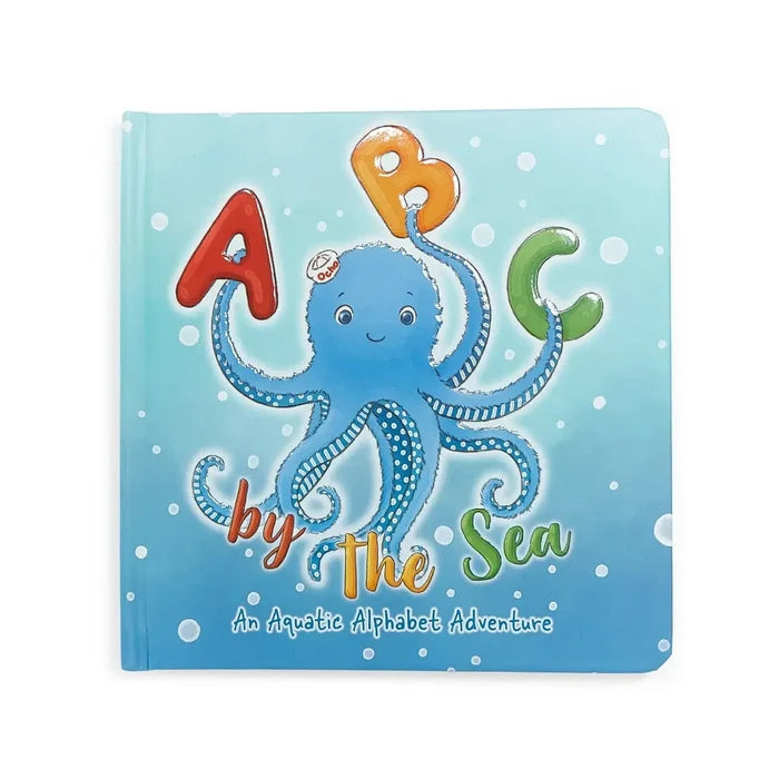 Children's book titled 'A B C by The Sea' with an octopus illustration on a blue background.
