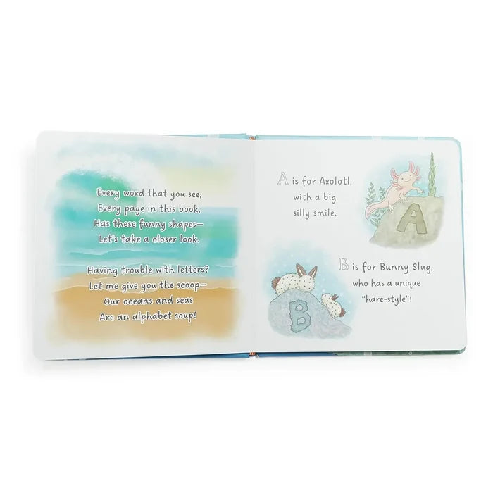 Open book with alphabet illustrations and text on a white background