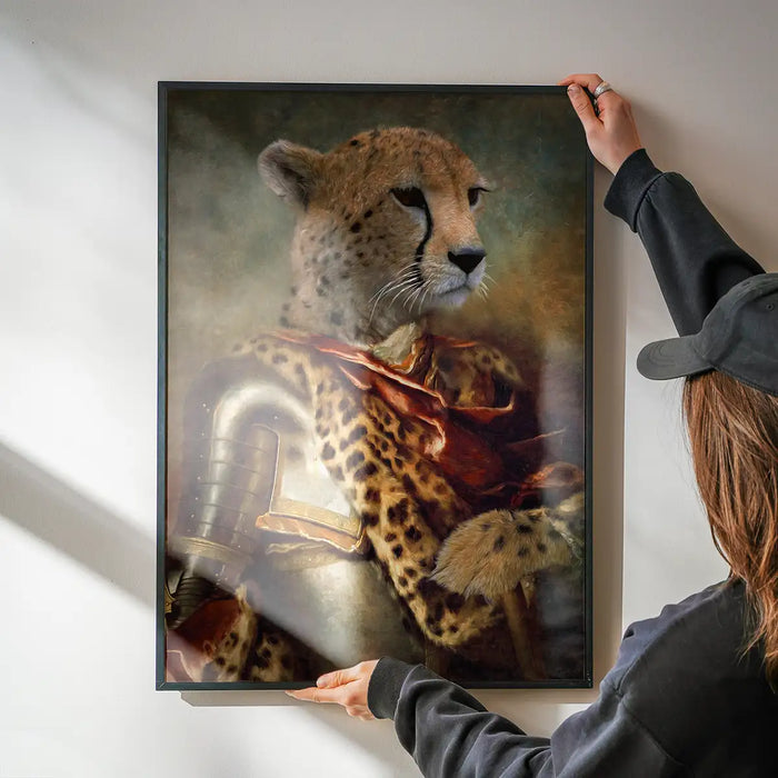 Cheetah Portrait Print being hung on a wall in a black frame