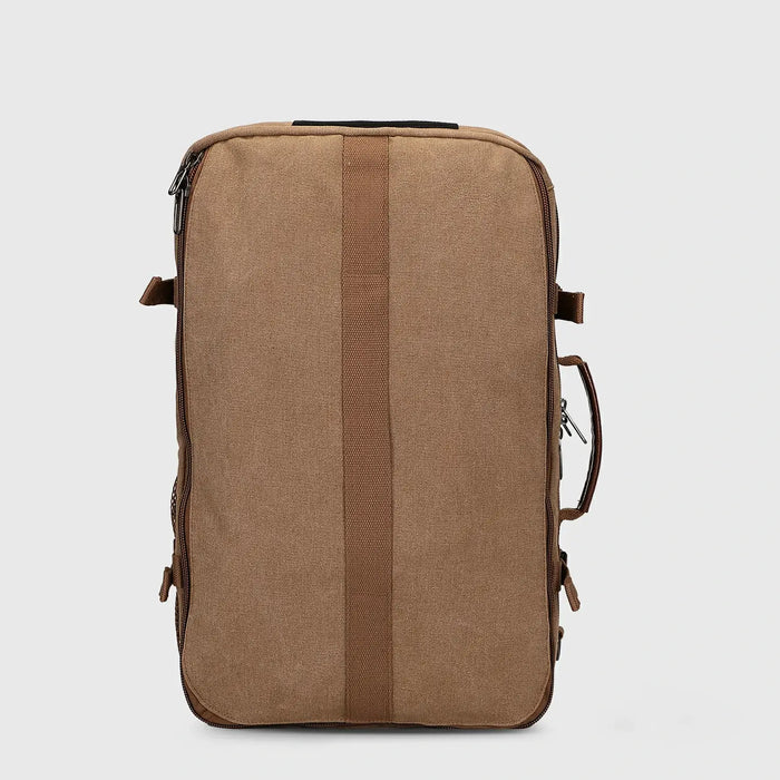 Side profile of WITZMAN brown canvas carry-on backpack with structured 45L design