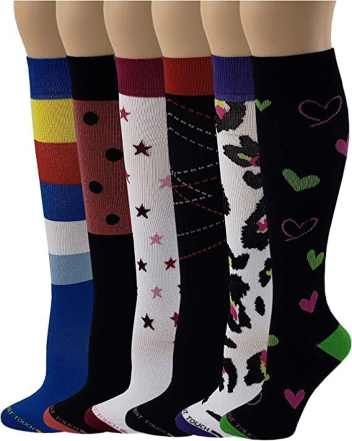 A collection of six different colorful compression knee-high socks with various patterns, including stripes, stars, hearts, and animal prints.