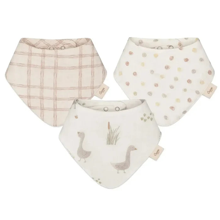 Three baby bibs with different patterns on a white background