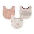 Three baby bibs arranged on a white background: one dusty pink with white floral print, one cream and taupe striped, and one cream with a muted pink floral print. Each bib has scalloped edges.