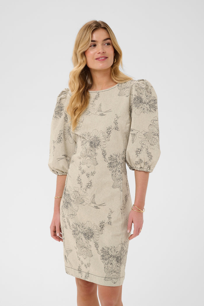 Cream CRVatta fitted jacquard dress in Ecru Flower featuring a textured floral and bird pattern with three-quarter puff sleeves.