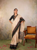 Cream Woven Tussar Silk Saree With Contrast Black Temple Border
