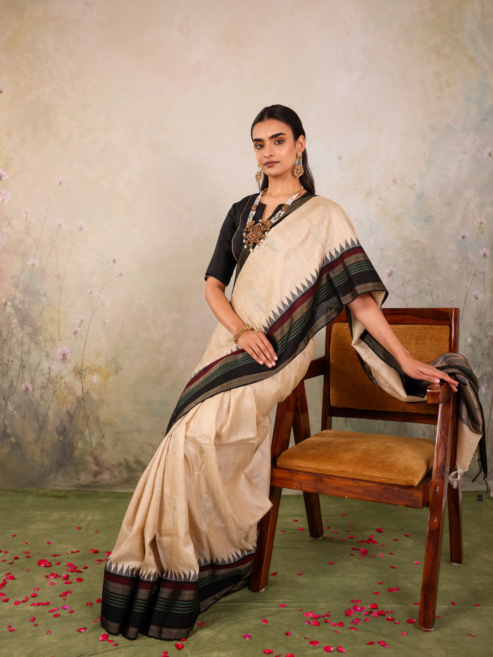 Cream Woven Tussar Silk Saree With Contrast Black Temple Border