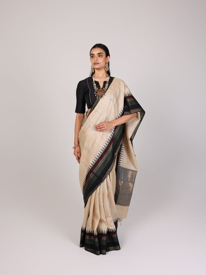 Cream Woven Tussar Silk Saree With Contrast Black Temple Border