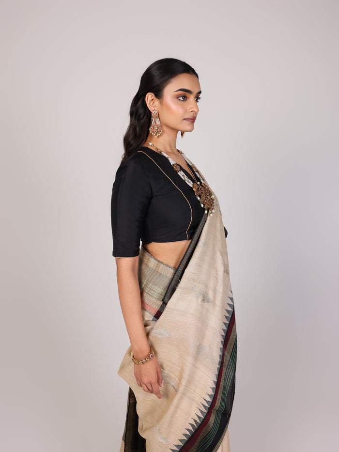 Cream Woven Tussar Silk Saree With Contrast Black Temple Border