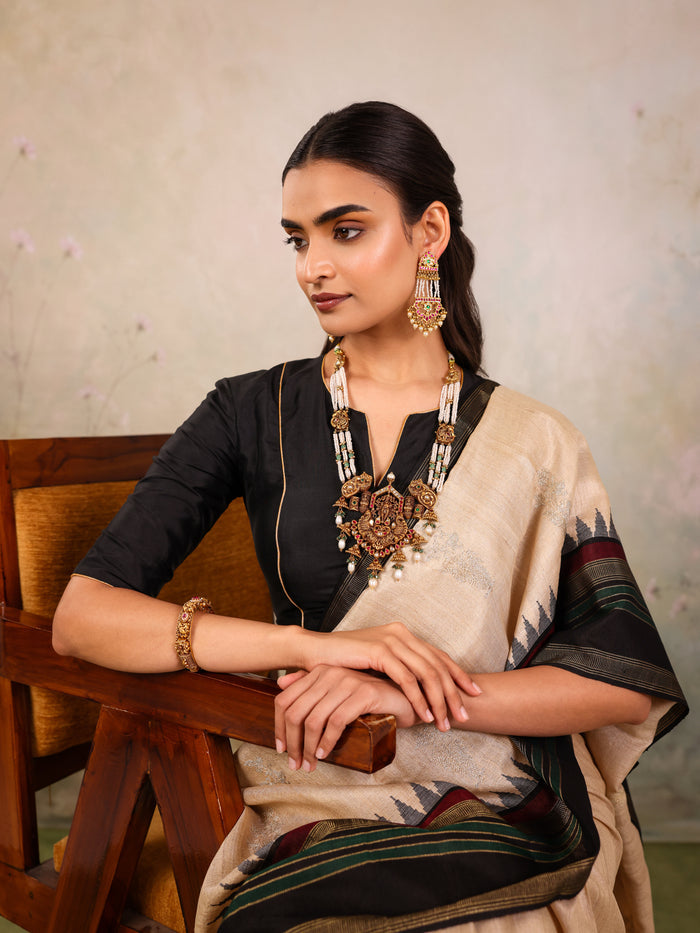 Cream Woven Tussar Silk Saree With Contrast Black Temple Border