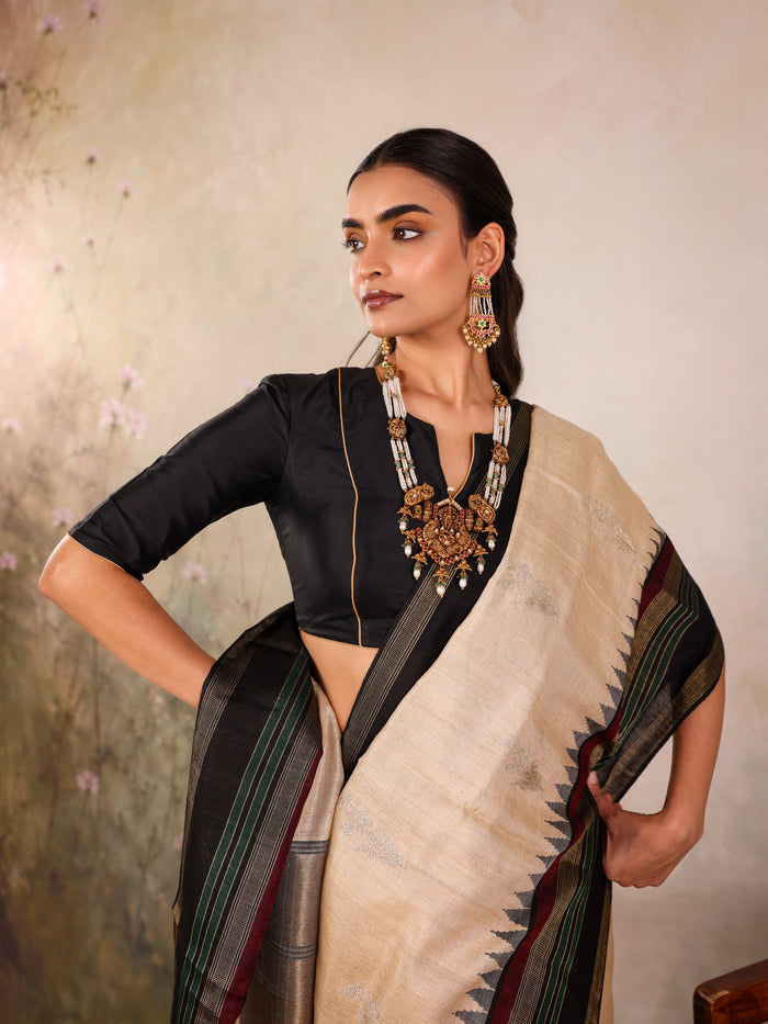Cream Woven Tussar Silk Saree With Contrast Black Temple Border