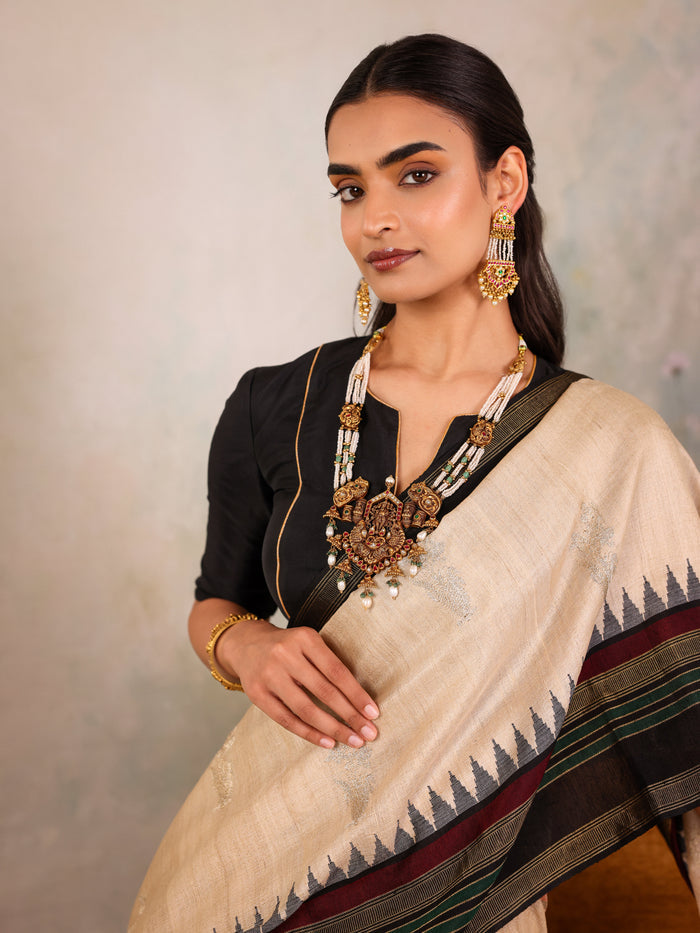 Cream Woven Tussar Silk Saree With Contrast Black Temple Border