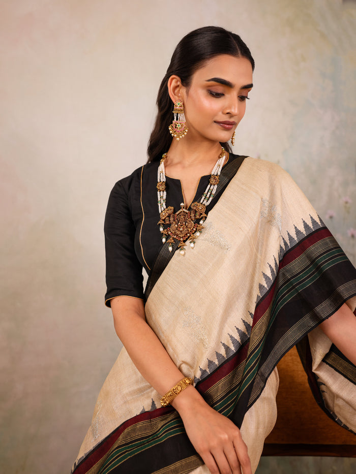 Cream Woven Tussar Silk Saree With Contrast Black Temple Border