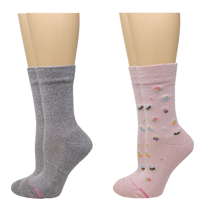 Gray and pink socks on mannequin feet with floral patterns.