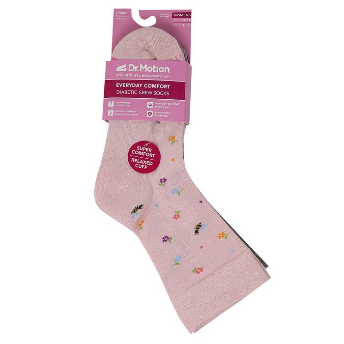 Pink sock with floral designs and Dr. Motion packaging on a white background