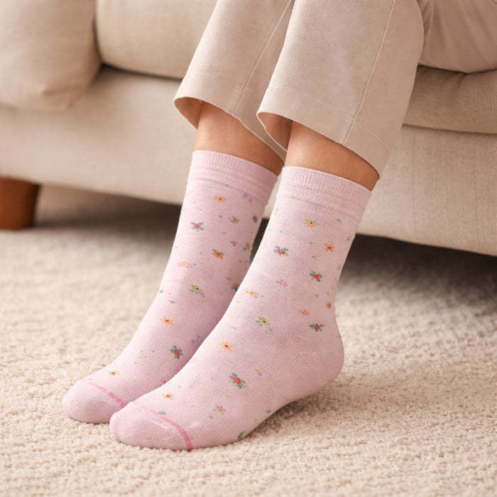 Person wearing light pink Dr. Motion everyday comfort diabetic crew socks pink