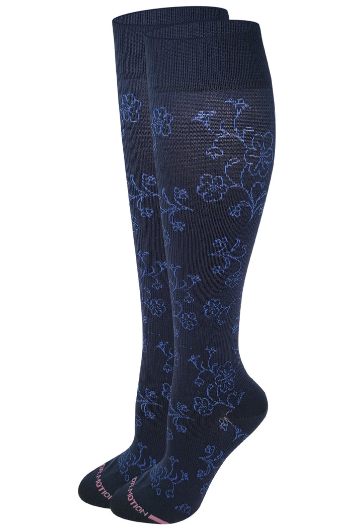 Navy blue knee-high socks with floral pattern on a white background