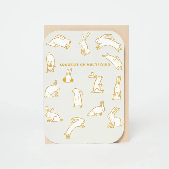 Greeting card with gold rabbit illustrations and text on a white background