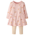 A toddler girl's two-piece set featuring a light pink long-sleeve tunic dress with a celestial print of crescent moons, stars, and dots, paired with light pink and white striped leggings.