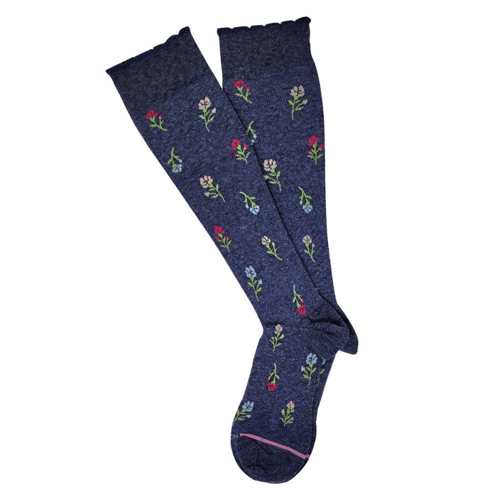 Navy blue knee-high socks with floral patterns on a white background
