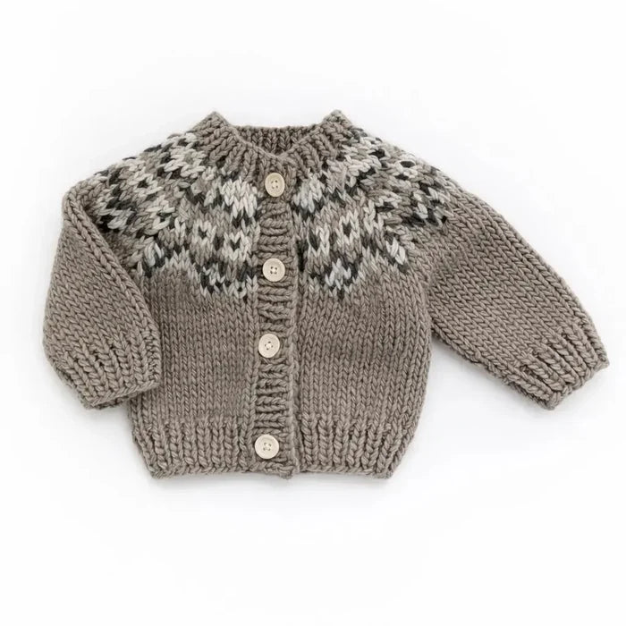 Knitted cardigan with patterned front on a white background