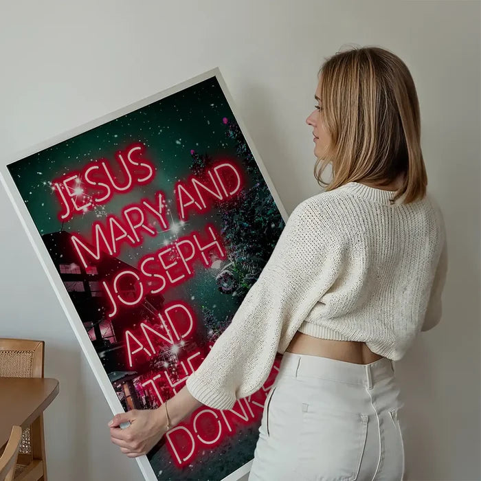 Jesus, Mary, Joseph & The Wee Donkey Christmas Print held up against a living room wall