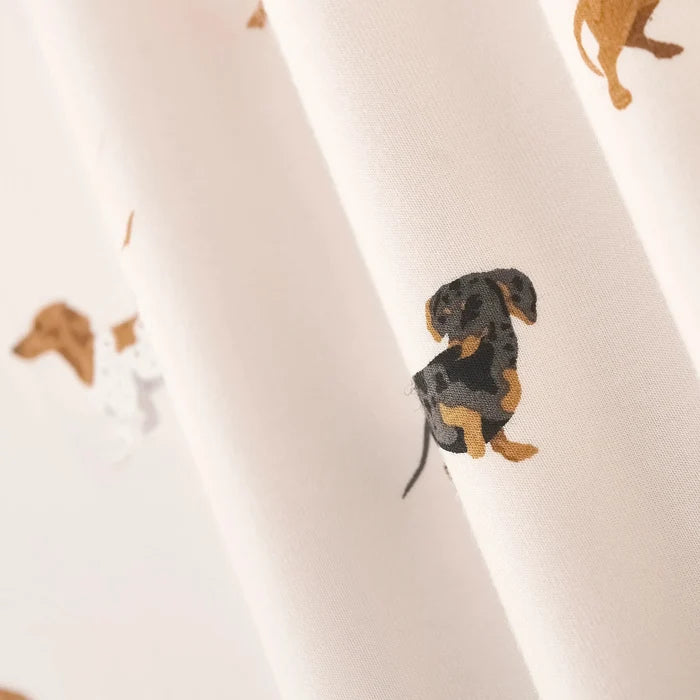 Fabric with dachshund pattern on a white background