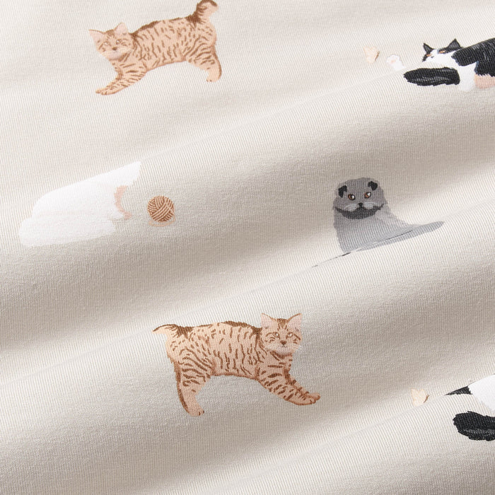 Fabric with cat and yarn pattern on a beige background
