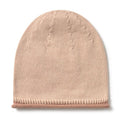 A light beige knit beanie hat with a ribbed cuff, shown flat against a white background.